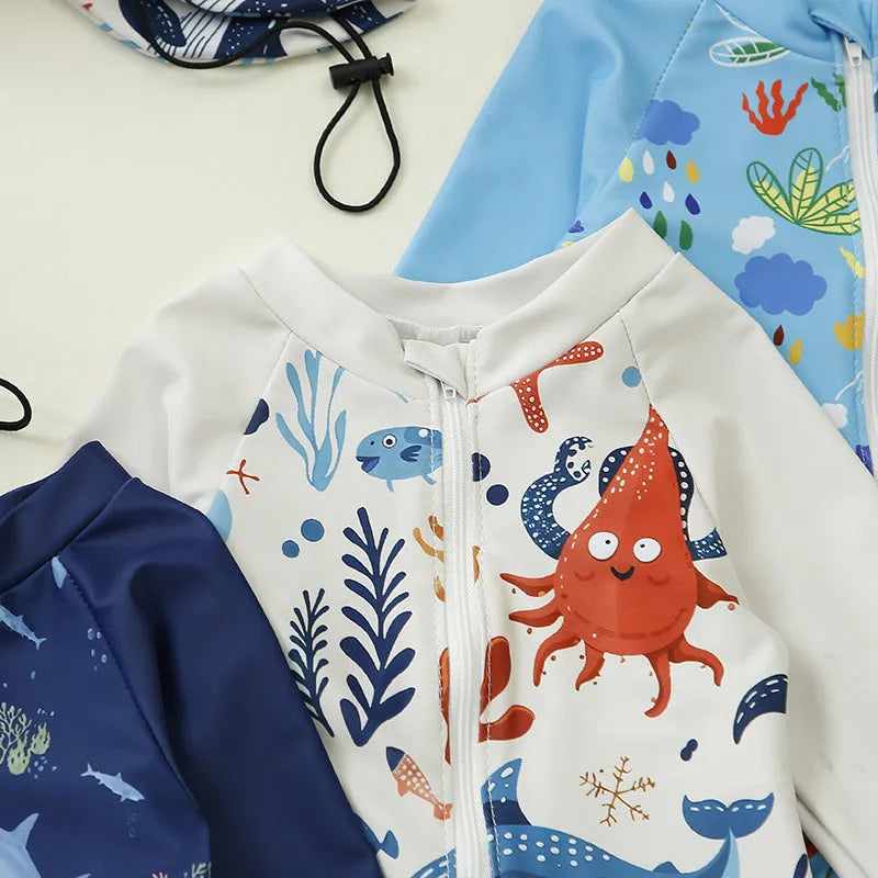 Children’s polyester jumpsuit swimsuit with hat in dark blue shark design, size 100