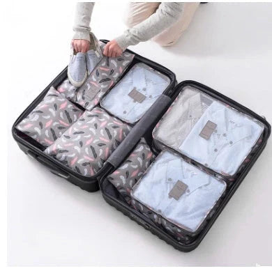 Durable waterproof packing cubes in various colors for organized, efficient travel