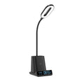Modern desk lamp with integrated wireless charging pad and storage box for pens.