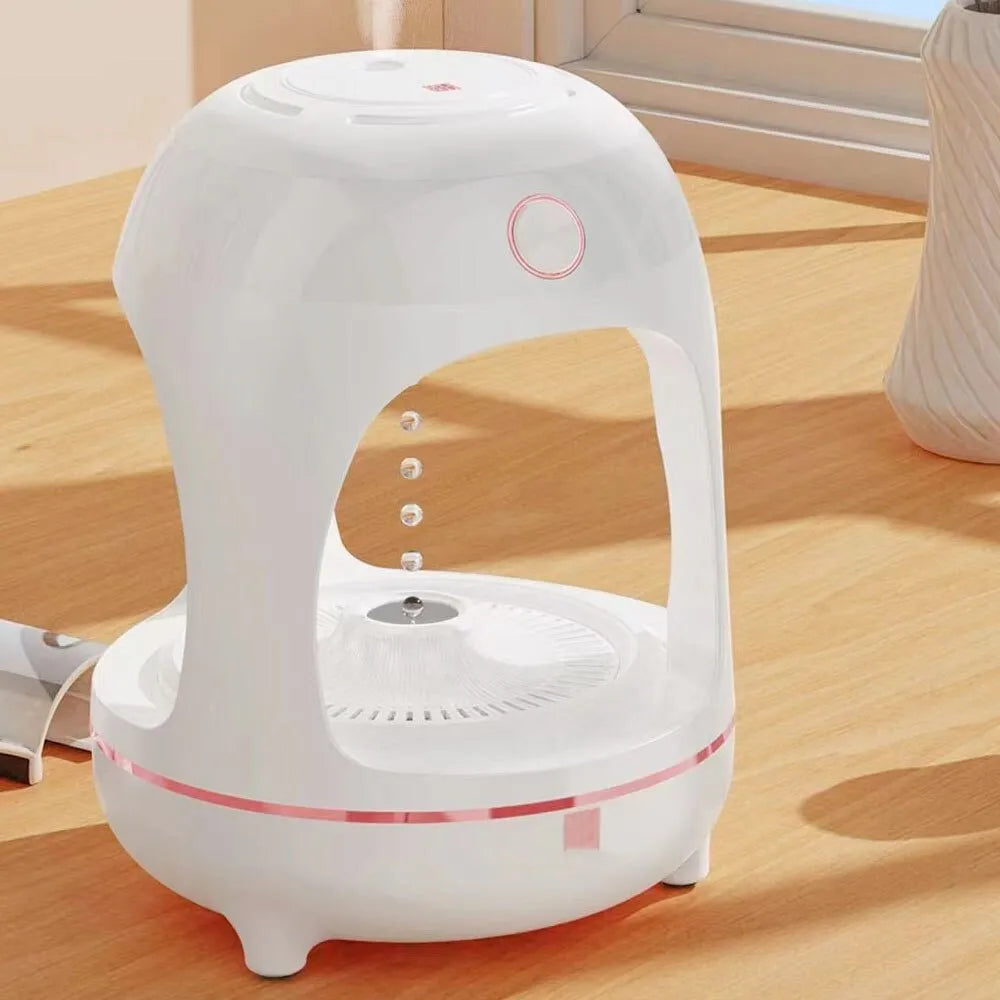 Rose gold and white columnar humidifier with levitating water drops and LED glow on a desk
