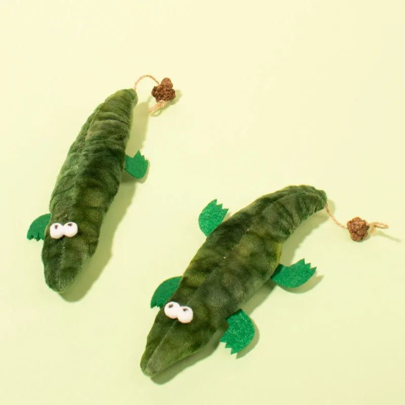 Green plush alligator catnip toy approximately 30 cm long with natural catnip filling and peppermint scent