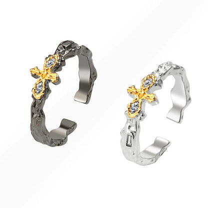 Dark Maillard Ring with geometric cross design in black gold and silver, adjustable for a perfect fit.