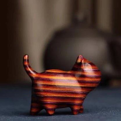 Handcrafted sandalwood kitten ornaments in various styles and colours