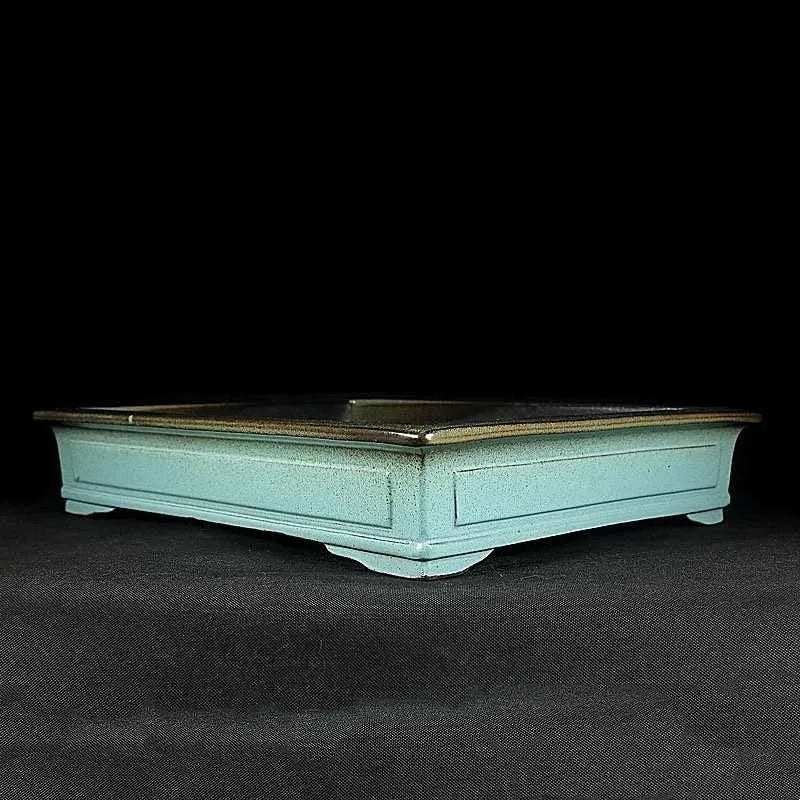 Green handmade ceramic bonsai flower pot with purple sand crackle glaze finish.