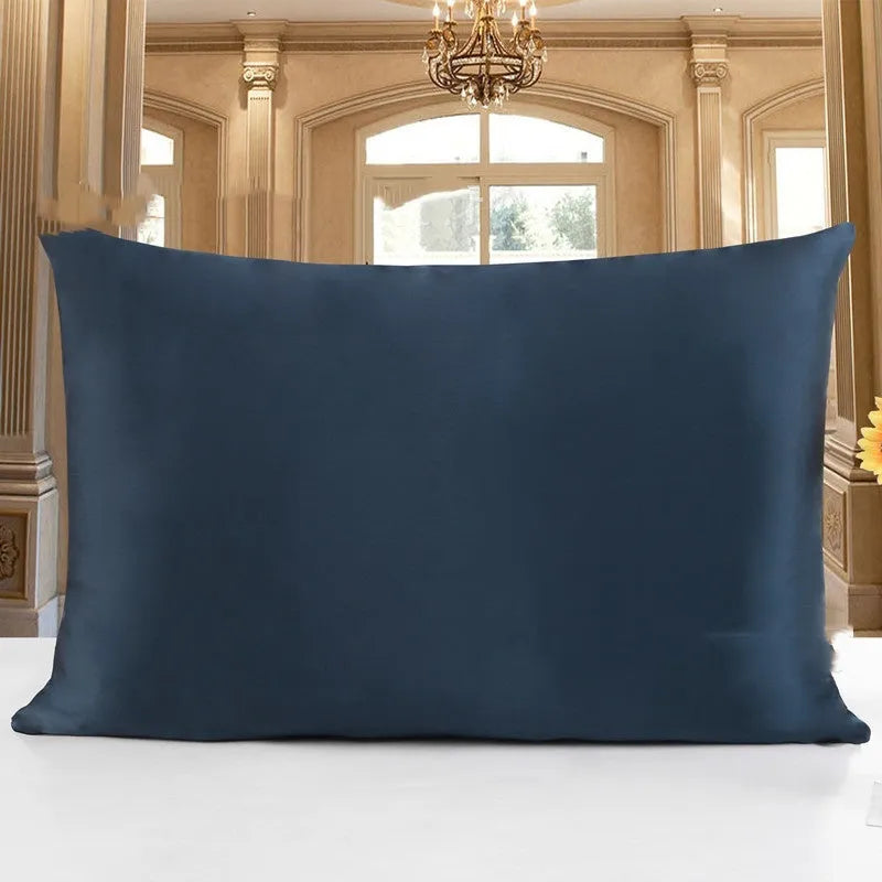 19 M double-sided silk pillowcase shown in one of 14 colours, including apricot, champagne, and navy blue.