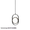 Nordic reversible magic eye bedside lamp with black vertical strip pattern on a bedside table