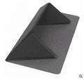 Blue foldable aluminium laptop cooling bracket open on a desk next to a laptop.