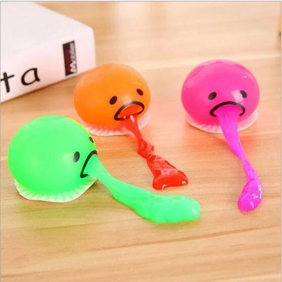 Gudetama Vomiting Egg Toy in green, orange, pink, and yellow