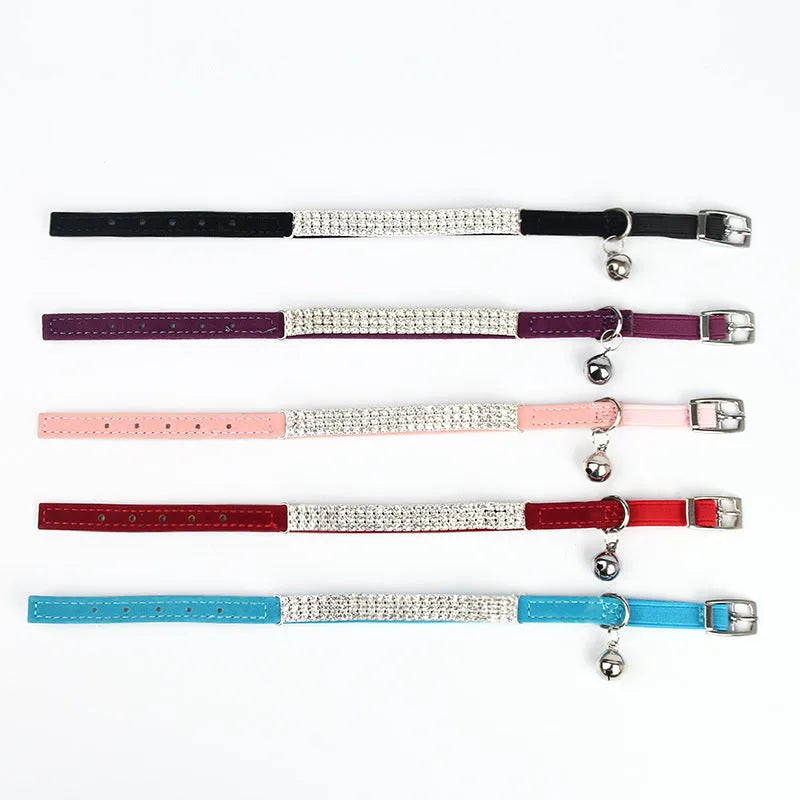 Rhinestone-decorated suede velvet cat collar shown in multiple colours on adjustable strap