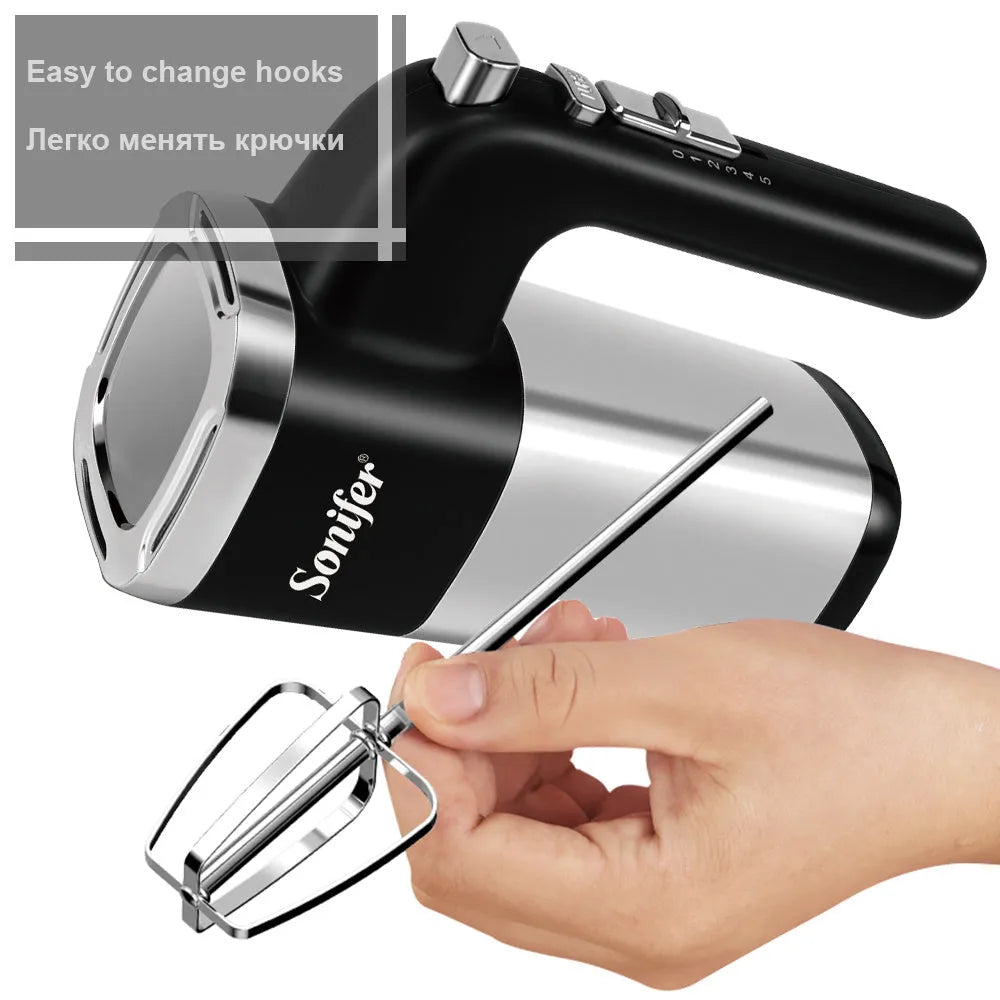 White 500W electric hand mixer with two metal beaters and turbo button