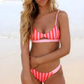 Women's bikini swimsuit in polyester, showing black and white dots and red and white stripes pattern options.