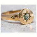 Gold-colour adjustable star ring with a central asterism zircon on a zinc alloy band.