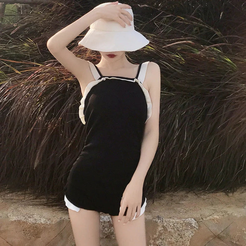 Women's one-piece swimsuit in nylon fabric showing colour options with size guidance information