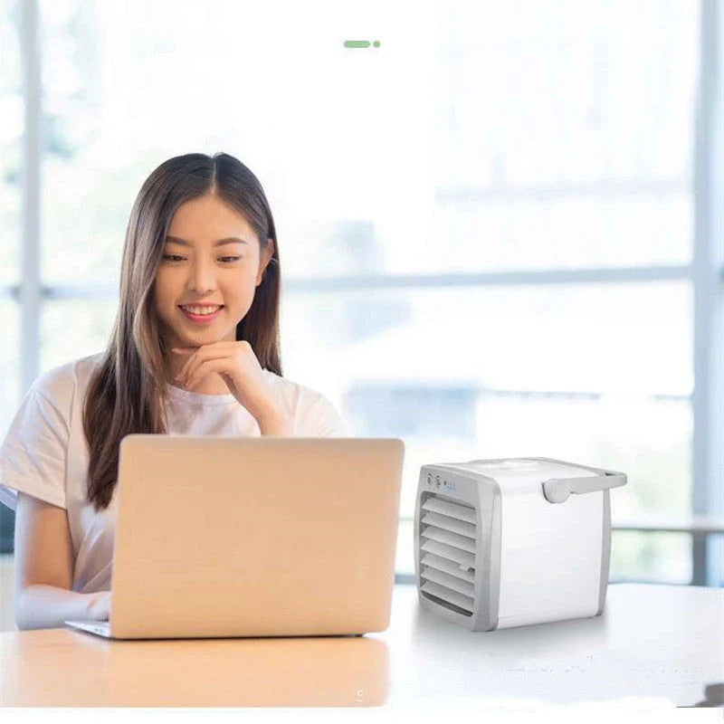 Mini mobile air conditioner electric fan in white with USB portability