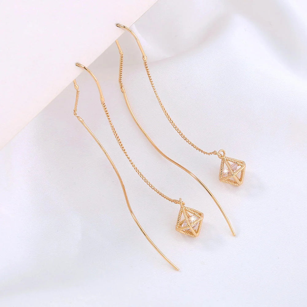 Gold Bronze Cutout Zircon Tassel Earrings with European design and sparkling accents