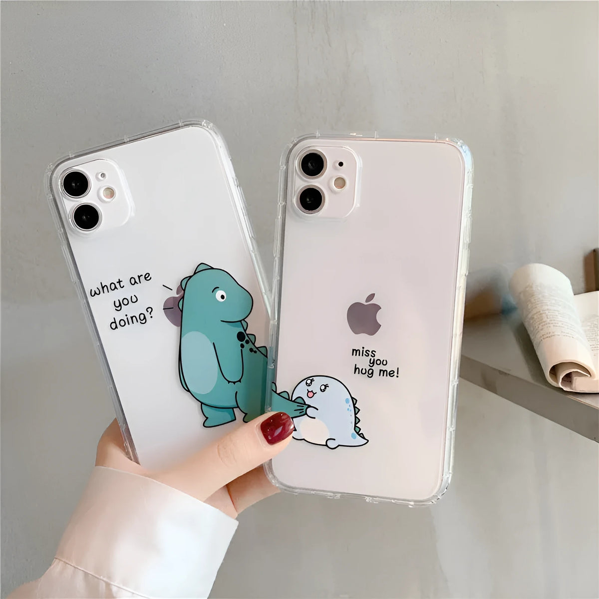Transparent silicone TPU iPhone case with airbag design and a green dinosaur graphic on the back.