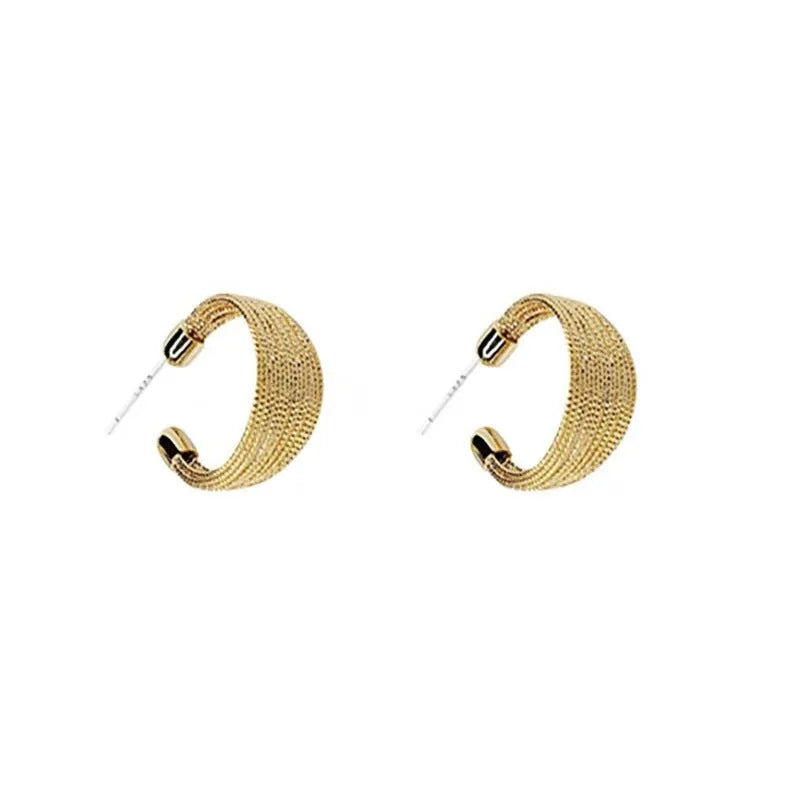 Set of four geometric earring pairs in silver and gold, including stud and clip styles