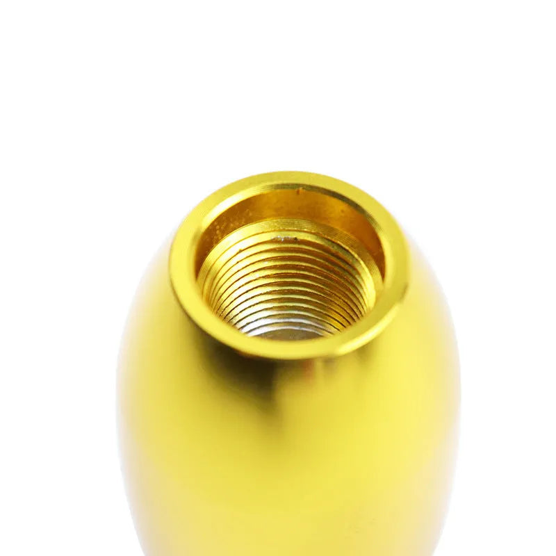 Universal aluminium alloy car gear shift knob with three rubber adaptor sleeves in sizes 8mm, 10mm, and 12mm.