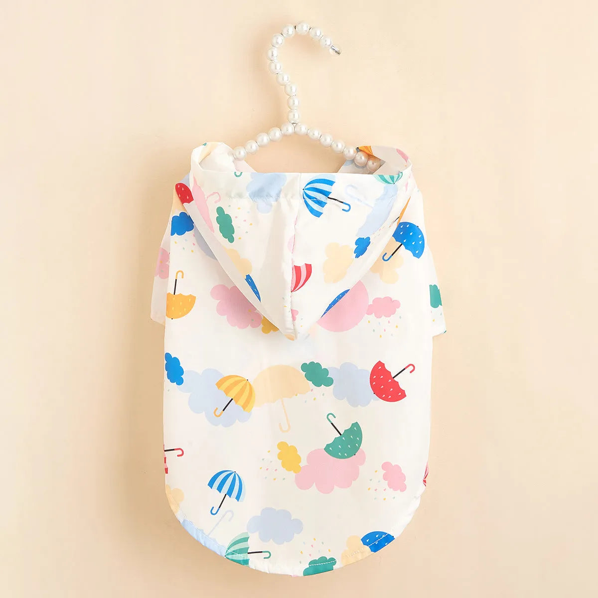 Colourful cartoon umbrella pattern dog or cat raincoat in multiple sizes.