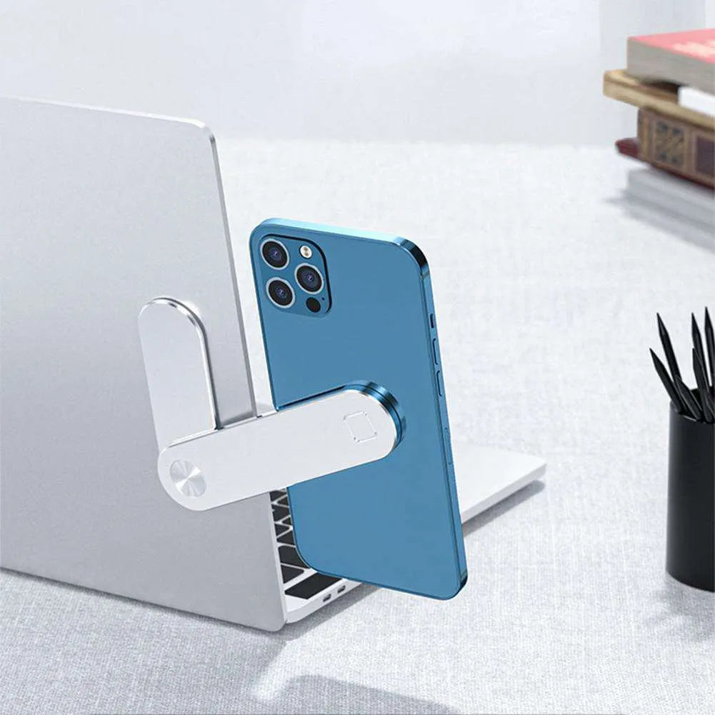 Black aluminium laptop phone holder mounted beside laptop screen showing dual-screen setup