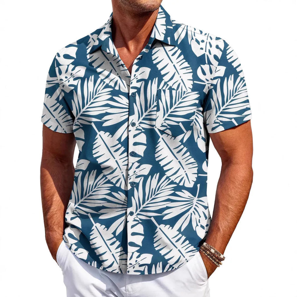 Man wearing a slim-fit Hawaiian pattern short-sleeve shirt in a casual setting.