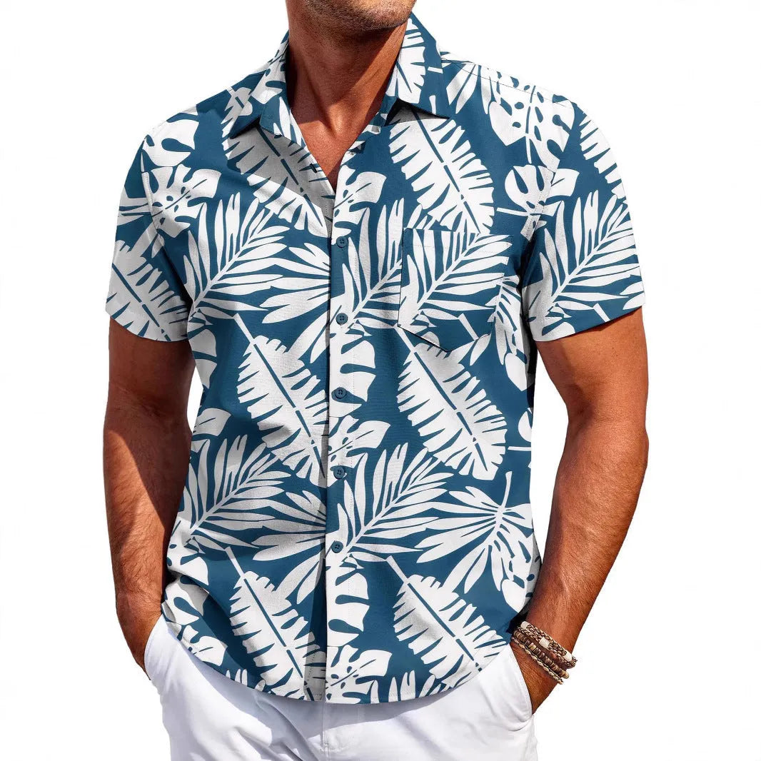 Man wearing a slim-fit Hawaiian pattern short-sleeve shirt in a casual setting.