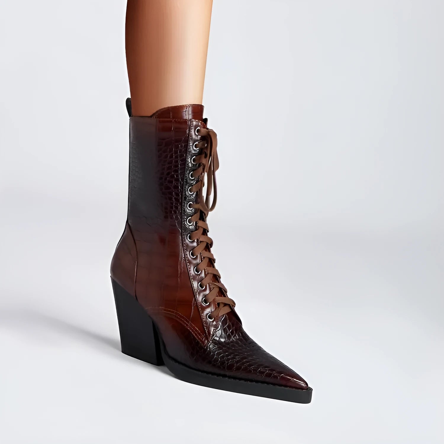 Dark brown women's ankle boot with retro stone pattern, pointed toe, and a chunky heel.