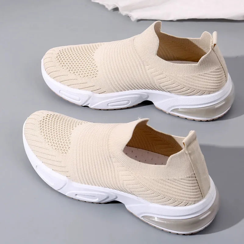 Slip-on breathable sock shoe in a low-top design with a mesh upper and PVC sole.
