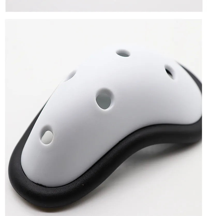 Black rubber sports genital protector for adult and child sizes used in hockey, rugby, and martial arts.
