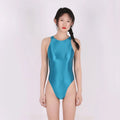 Plus size woman modelling a glossy purple one-piece swimsuit, showing the tights style and stretch fit.