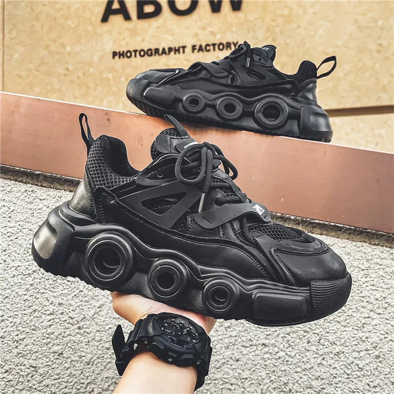 Men's black casual sneakers with a breathable mesh upper and thick rubber sole for height increase