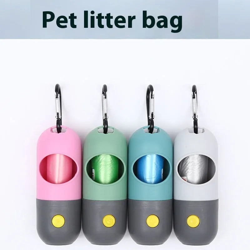 Compact LED pet waste bag dispenser in blue grey with a dog lead attachment and illuminated button