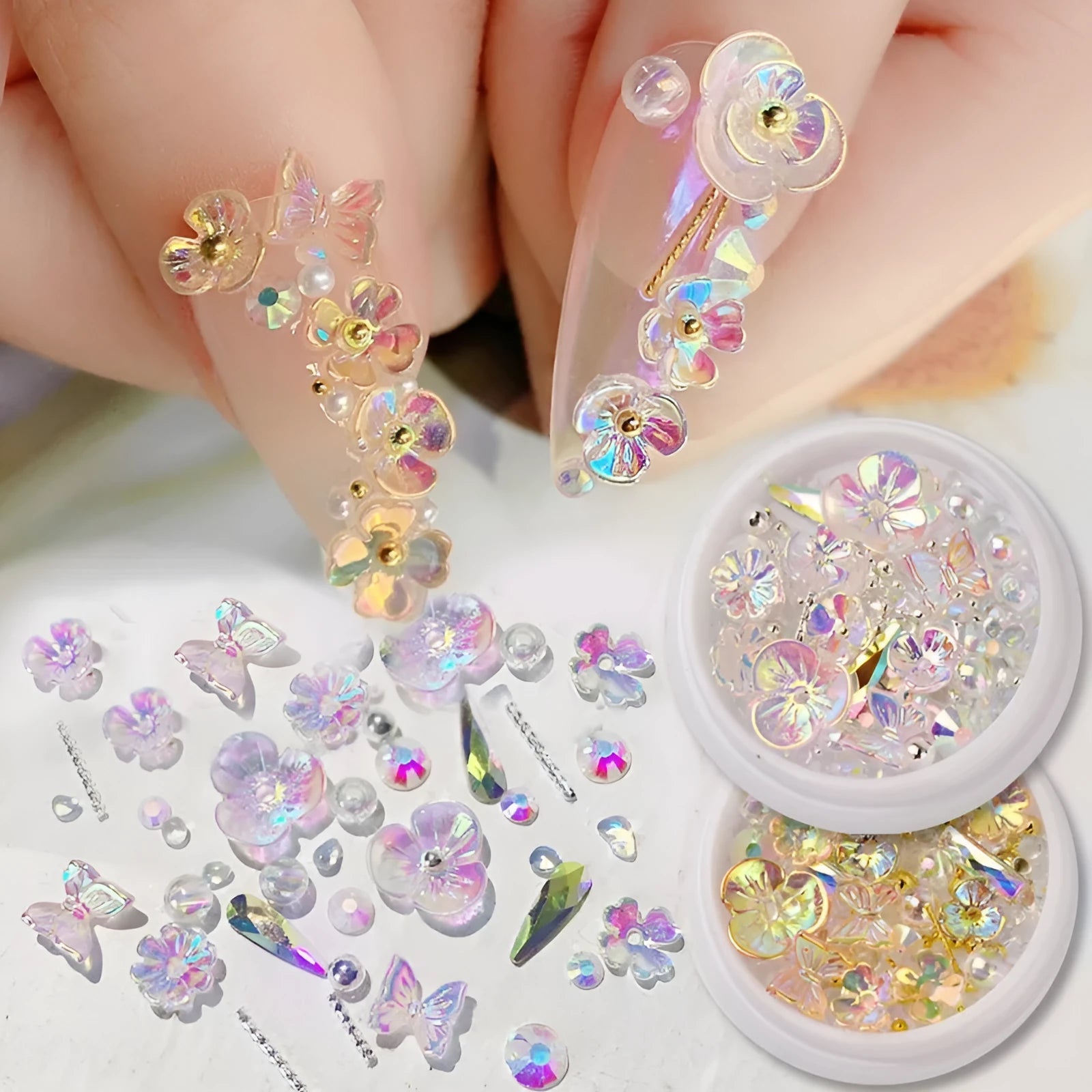 Container of flower and butterfly shaped nail sequins in mixed colours blue champagne grey pink transparent yellow