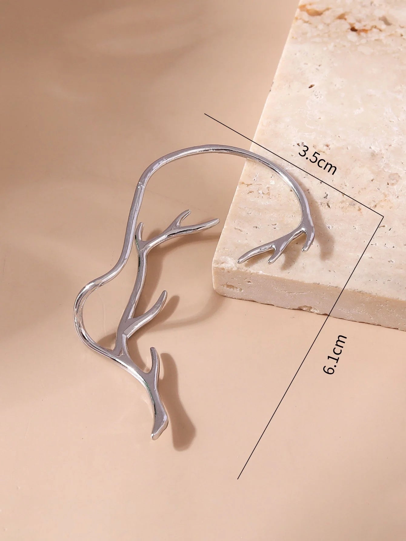 Vintage bone hypoallergenic elf earrings in gold, silver, black, and green with geometric design