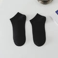 Pair of solid colour low-cut boat socks for men, made from breathable polyester.