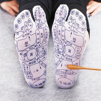 Acupressure foot massager socks with reflexology charts for enhanced therapy