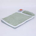 A large grey washable dog mat with a detachable cover, shown with a dog lying on it.