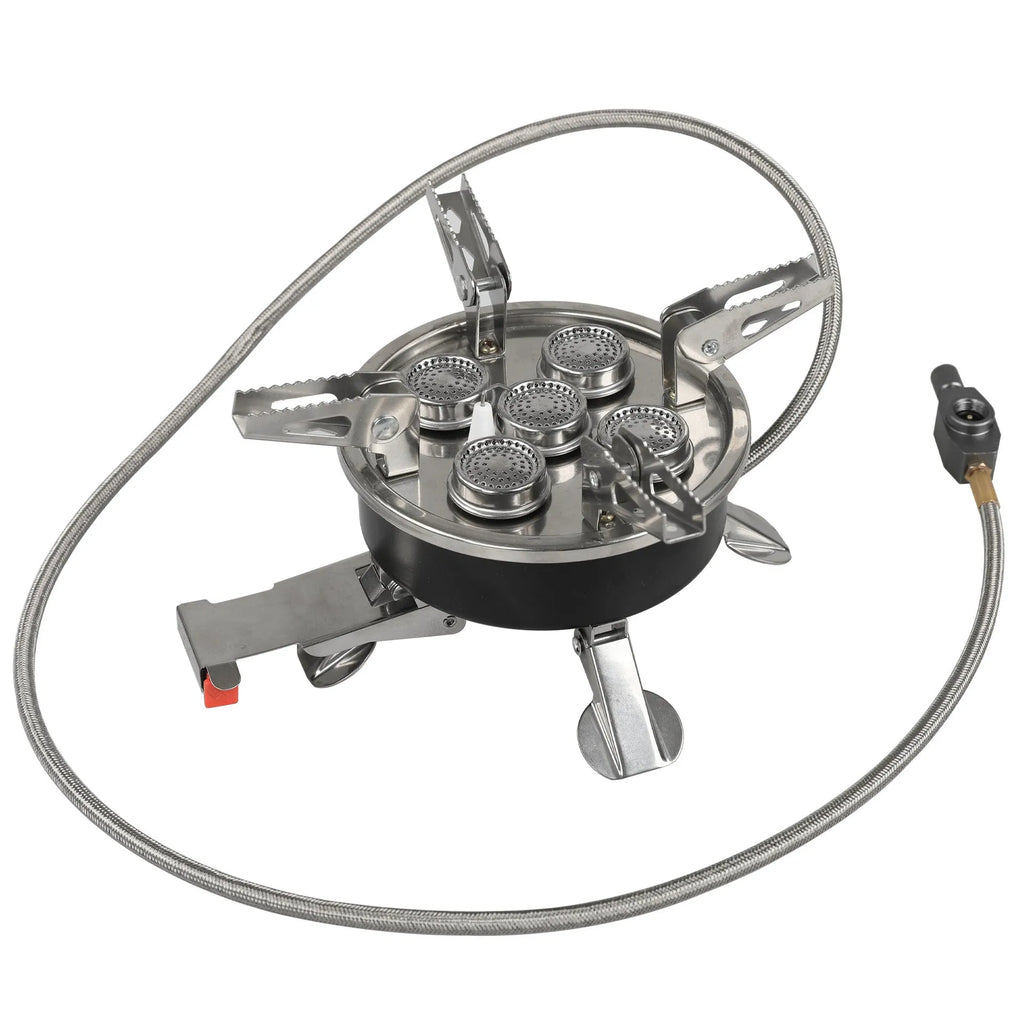 Silver portable split stove for outdoor camping and picnics on a flat surface.