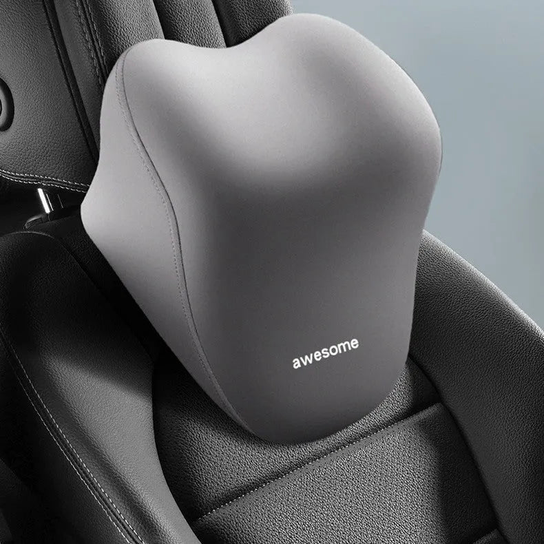 Y-type beige automotive headrest pillow and lumbar support pillow set with memory foam filling on a car seat