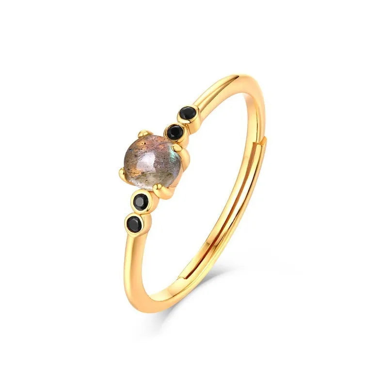 Gold coloured open ring with geometric round shape on silver base with electroplating