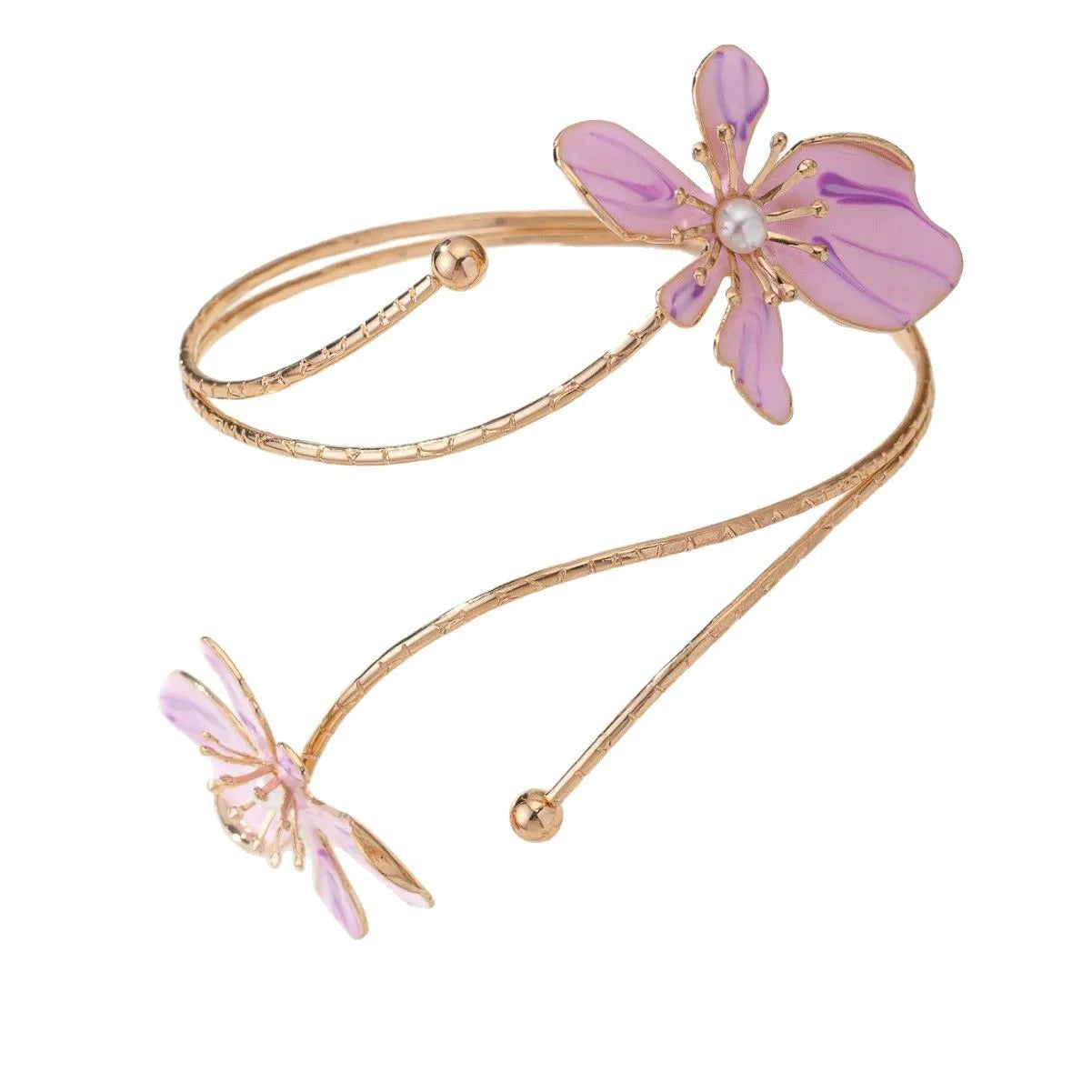 Close-up of a pink alloy armband with a hollow patterned design, shown on a wrist.