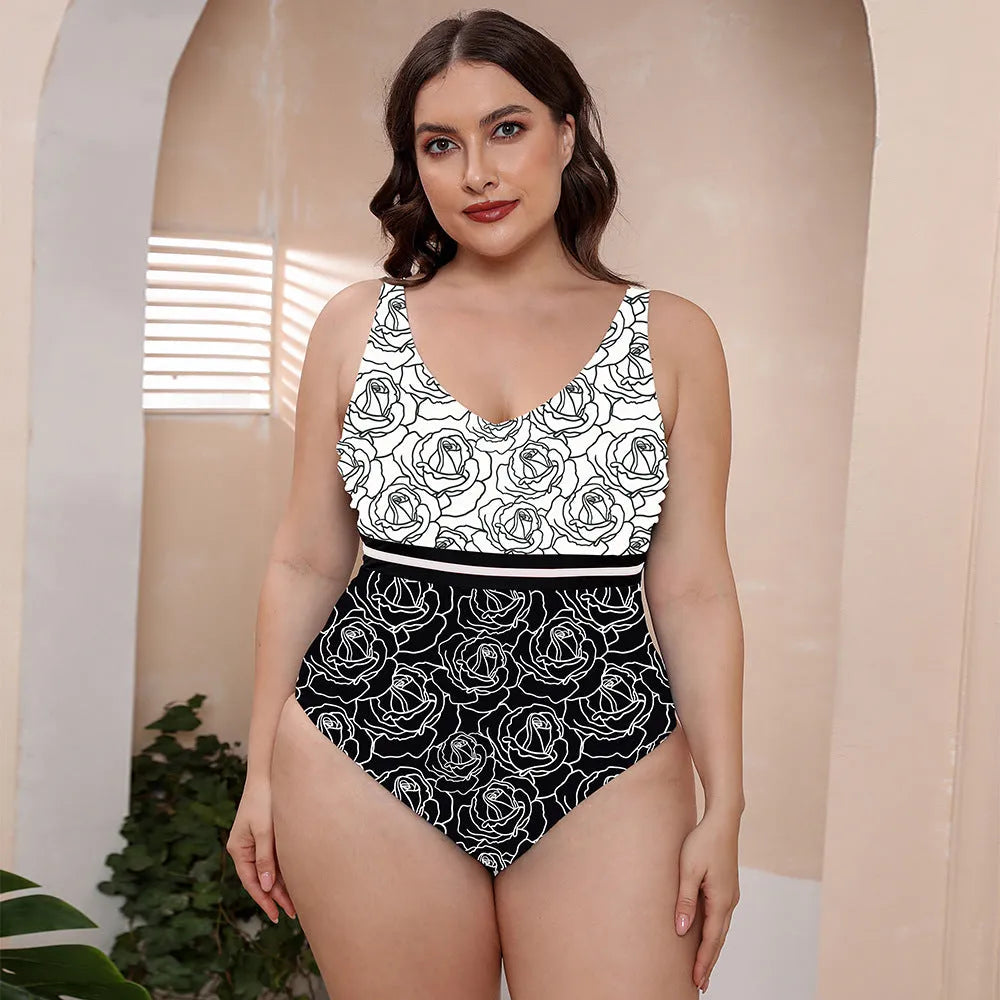 Women's blue printed one-piece swimsuit with spaghetti straps and a striped vest design laid flat.