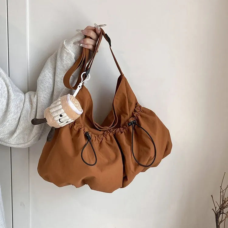 Ultra-light pleated crossbody student cloth bag in polyester with folding design and internal phone compartment