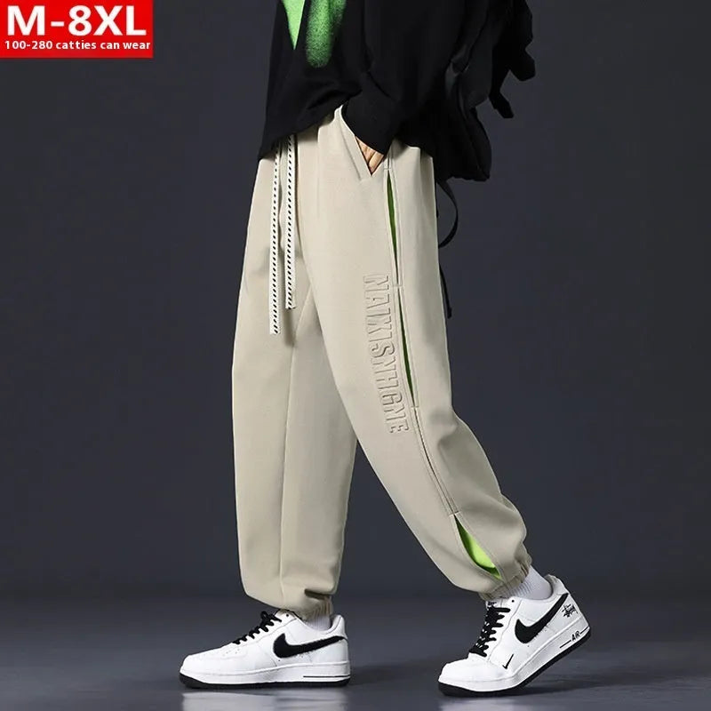 Men's grey green loose fit jogger pants with elasticated ankle bands and waist.