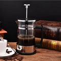 Glass and stainless steel pour-over coffee maker with 350ml capacity measuring 10x8x17cm