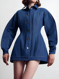 Blue denim corset-style shirt dress with patchwork design and statement buttons on a model, mini length