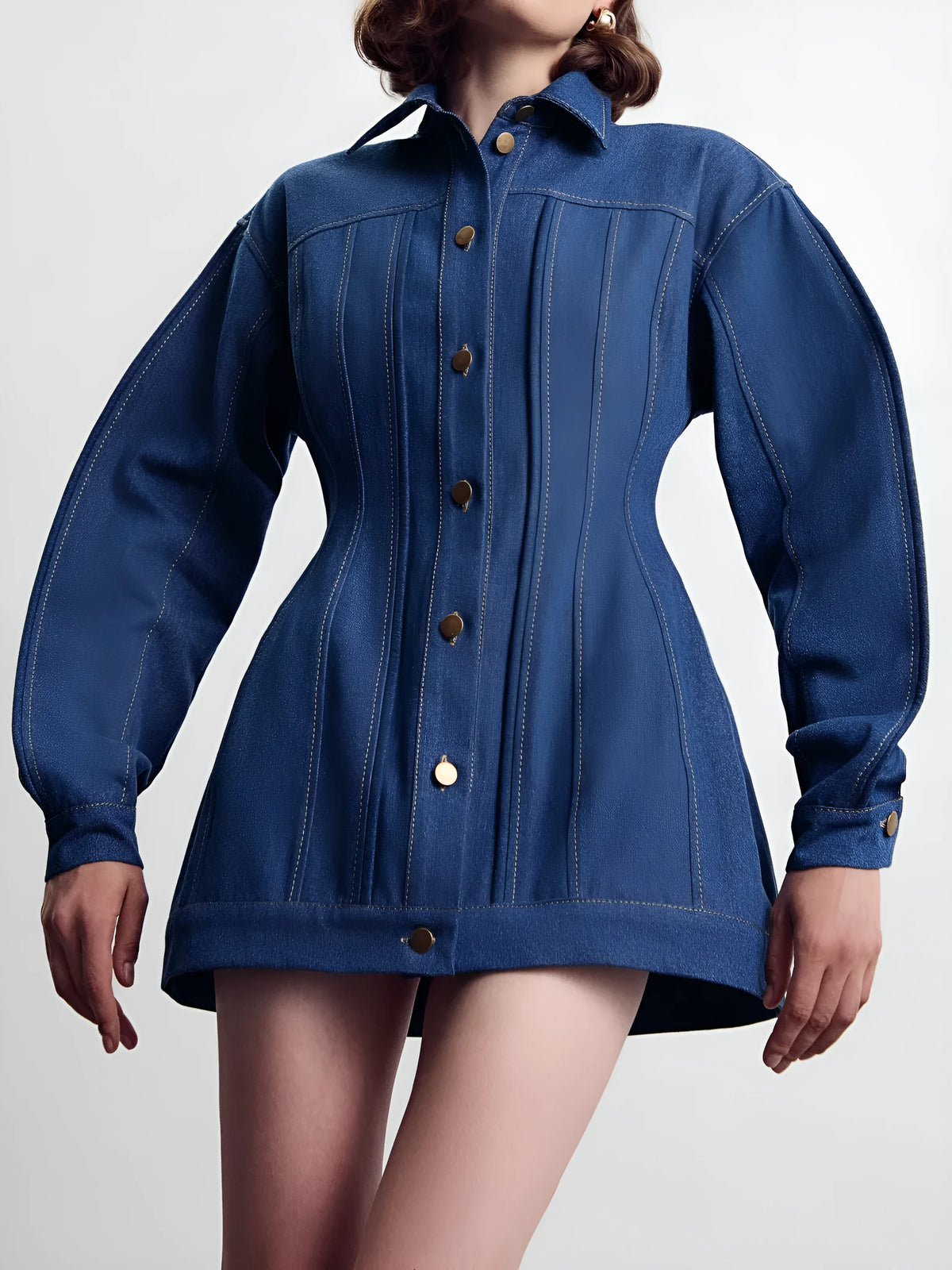 Blue denim corset-style shirt dress with patchwork design and statement buttons on a model, mini length