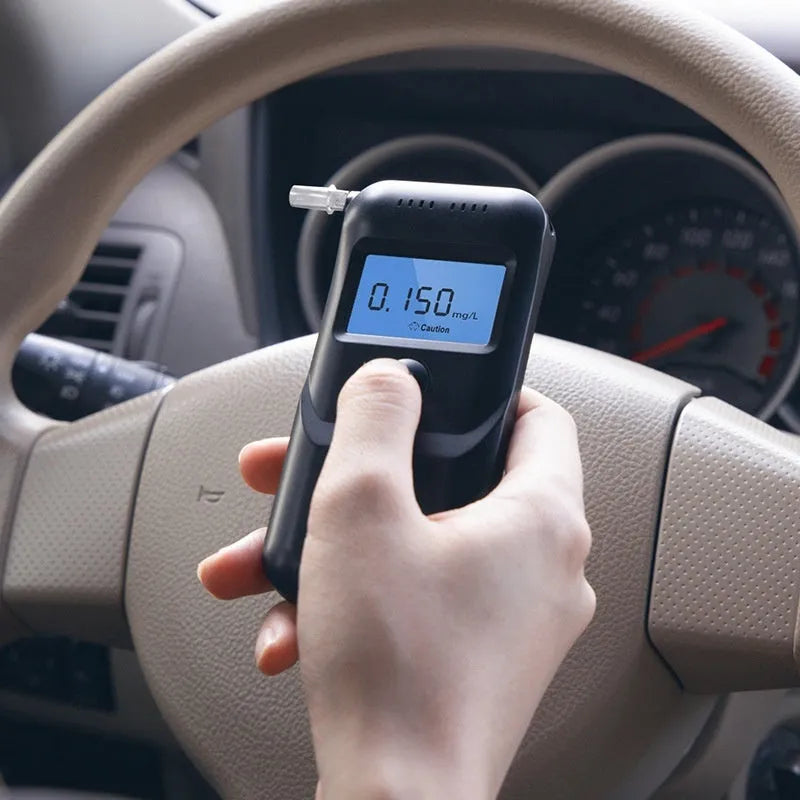Black household alcohol tester breathalyser with digital display for breath alcohol detection