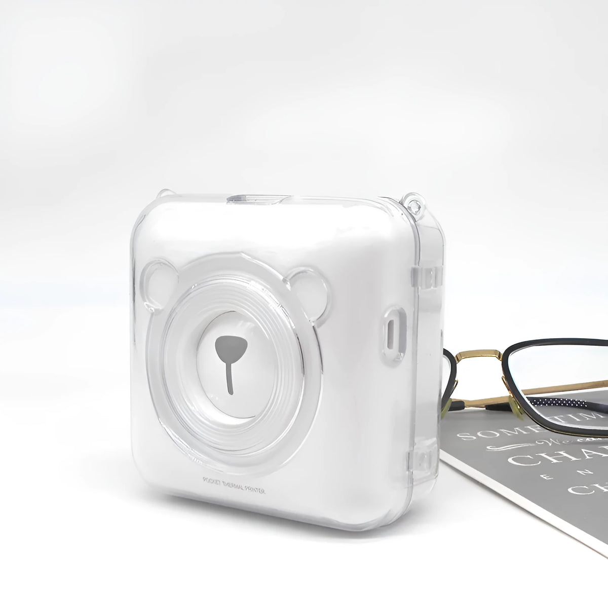 Crystal transparent PC protective case fitted on an Eric Bear A6 thermal printer, showing snap-on design