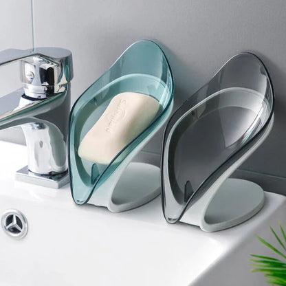 Self-draining leaf-shaped soap dish made of durable ABS material, featuring a unique triangle structure to prevent soap from slipping